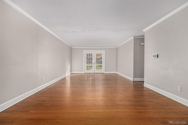 unfurnished room featuring hardwood / wood-style flooring, ornamental molding, and french doors