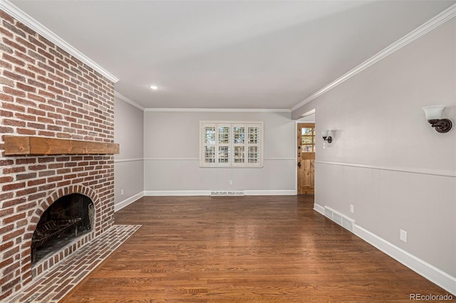 unfurnished living room with a fireplace, crown molding, and dark hardwood / wood-style flooring