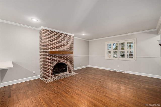 unfurnished living room with crown molding, dark wood-type flooring, and a brick fireplace