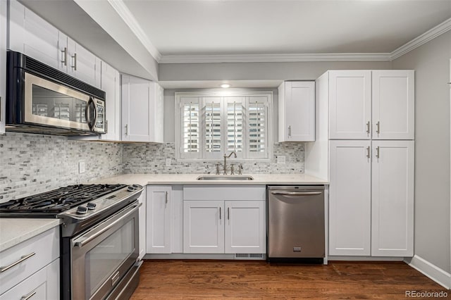 kitchen with sink, white cabinets, stainless steel appliances, and dark hardwood / wood-style floors