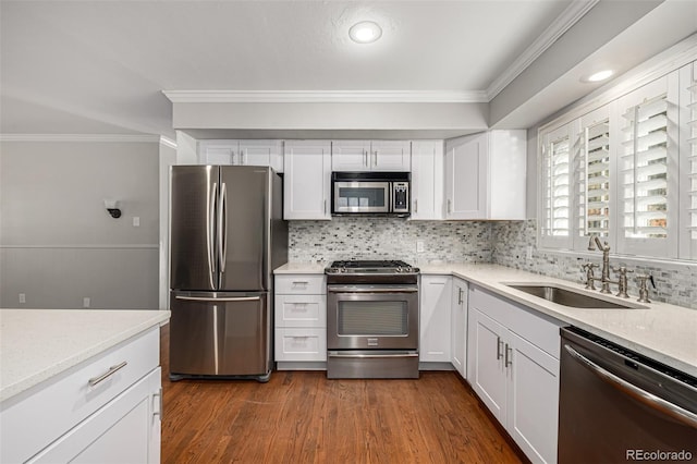 kitchen featuring white cabinets, appliances with stainless steel finishes, and sink