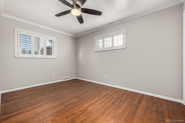 unfurnished room with dark hardwood / wood-style floors, ceiling fan, and ornamental molding