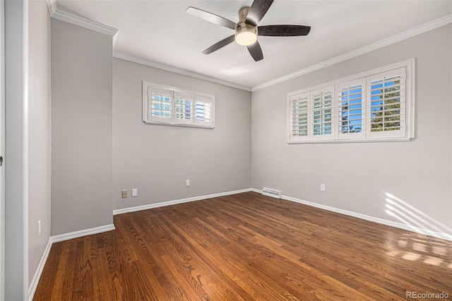 empty room with dark hardwood / wood-style floors, ceiling fan, and crown molding