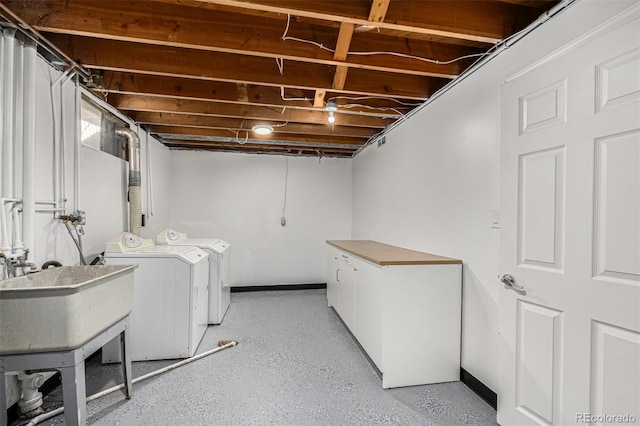 clothes washing area with separate washer and dryer