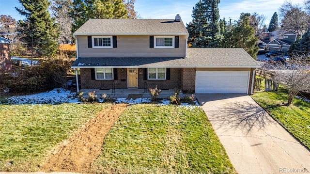 view of front property featuring covered porch, a garage, and a front lawn