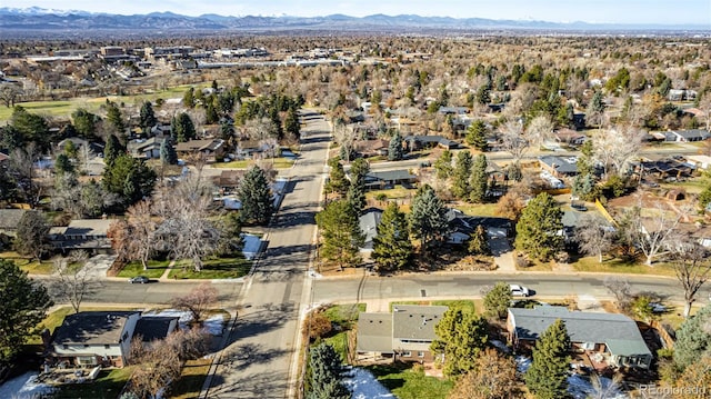 birds eye view of property with a mountain view