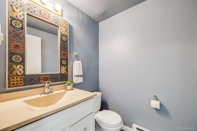 3870 S Ouray Way, Aurora, CO 80013 - half bathroom with vanity and a textured ceiling