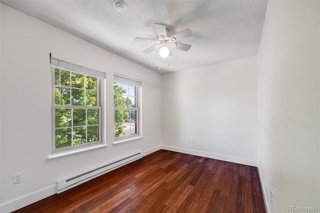 3870 S Ouray Way, Aurora, CO 80013 - spare room featuring a baseboard radiator, dark wood finished floors, a ceiling fan, a textured ceiling, and a smoke detector