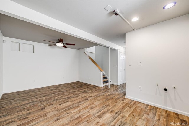 3870 S Ouray Way, Aurora, CO 80013 - basement with wood finished floors, a ceiling fan, stairs, and recessed lighting