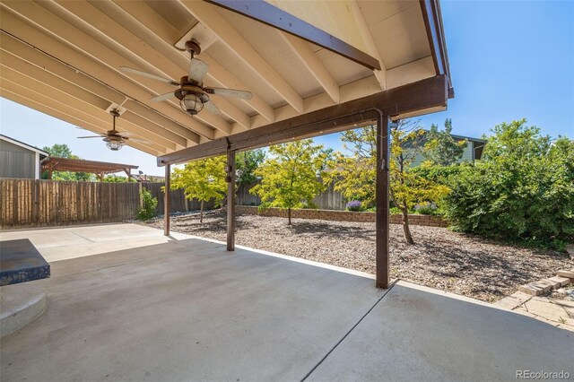 3870 S Ouray Way, Aurora, CO 80013 - fenced backyard with ceiling fan and a patio