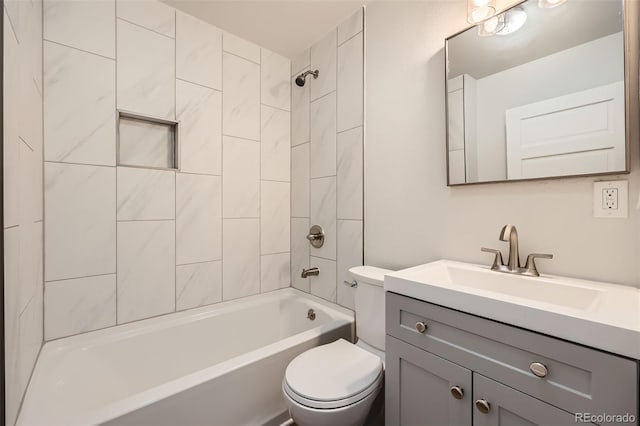 full bathroom with vanity, toilet, and tiled shower / bath