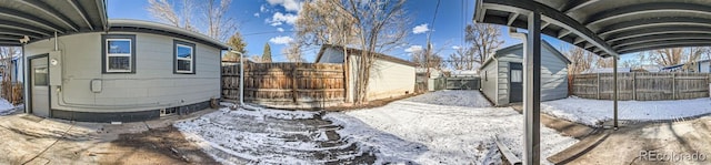 view of yard layered in snow