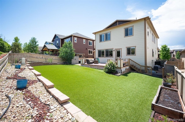 3834 Donnington Cir, Castle Rock, CO 80104 - back of house with a vegetable garden, a fenced backyard, and a deck