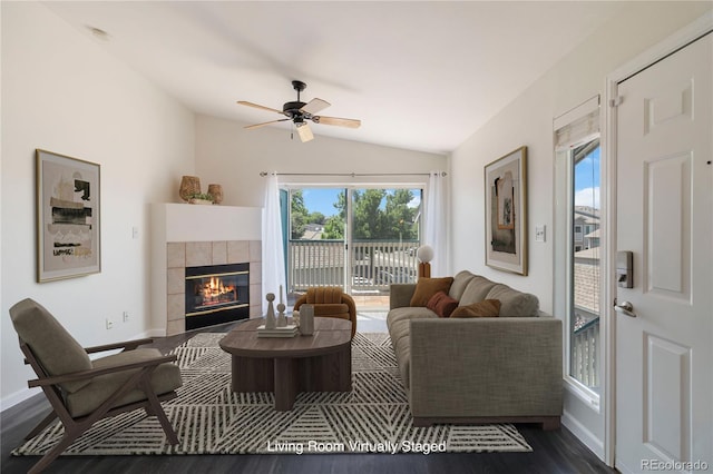 3825 Canyon Ranch Rd Unit 203, Highlands Ranch, CO 80126 - living room with vaulted ceiling, dark wood-style floors, a fireplace, and ceiling fan
