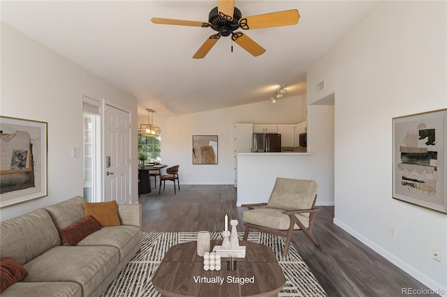 3825 Canyon Ranch Rd Unit 203, Highlands Ranch, CO 80126 - living room featuring vaulted ceiling, dark wood-type flooring, and ceiling fan