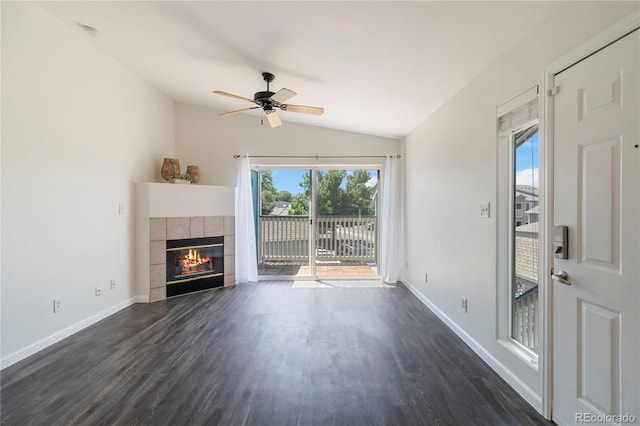 3825 Canyon Ranch Rd Unit 203, Highlands Ranch, CO 80126 - unfurnished living room with dark wood finished floors, a fireplace, vaulted ceiling, and a ceiling fan