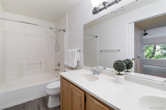 3825 Canyon Ranch Rd Unit 203, Highlands Ranch, CO 80126 - bathroom featuring double vanity, wood finished floors, tub / shower combination, and ceiling fan