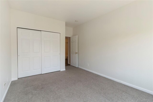 3825 Canyon Ranch Rd Unit 203, Highlands Ranch, CO 80126 - unfurnished bedroom featuring carpet flooring and a closet