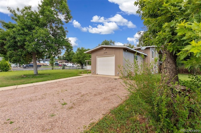 1209 Maxwell St, Colorado Springs, CO 80906 - garage with dirt driveway