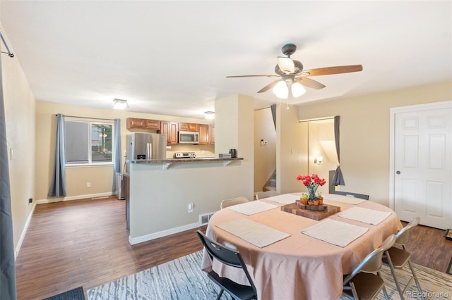 1209 Maxwell St, Colorado Springs, CO 80906 - dining space with stairs, dark wood-style flooring, and a ceiling fan