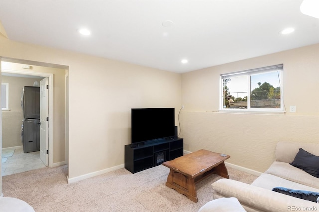 1209 Maxwell St, Colorado Springs, CO 80906 - living room featuring carpet floors, stacked washer / drying machine, and recessed lighting