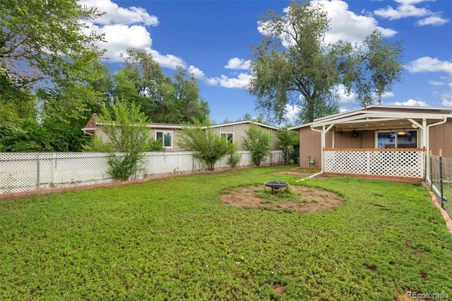 1209 Maxwell St, Colorado Springs, CO 80906 - fenced backyard featuring a fire pit