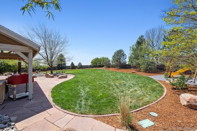 4815 Lucille Ct, Loveland, CO 80537 - view of yard with a patio and a fire pit