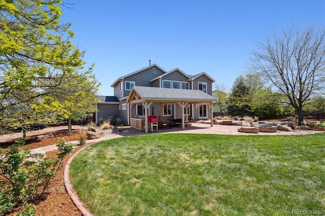 4815 Lucille Ct, Loveland, CO 80537 - back of house featuring a fire pit, a patio, a lawn, and a shingled roof