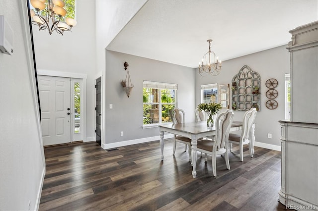 4815 Lucille Ct, Loveland, CO 80537 - dining area with a chandelier, dark wood-type flooring, and baseboards