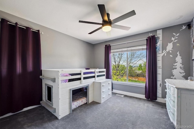 4815 Lucille Ct, Loveland, CO 80537 - carpeted bedroom featuring a ceiling fan, a fireplace, and baseboards