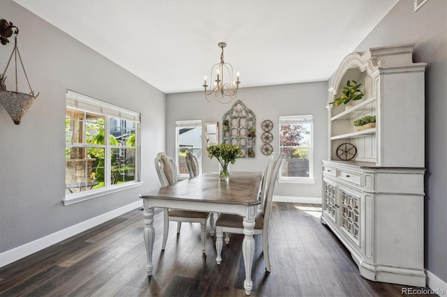 4815 Lucille Ct, Loveland, CO 80537 - dining space featuring a chandelier, baseboards, and dark wood-style floors