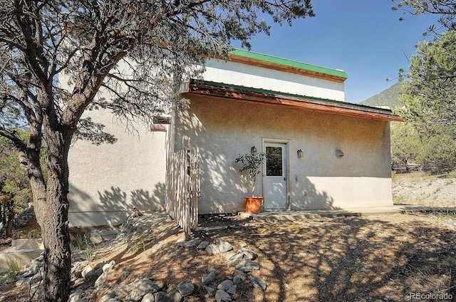 16715 Shadow Ln, Nathrop, CO 81236 - rear view of house featuring stucco siding