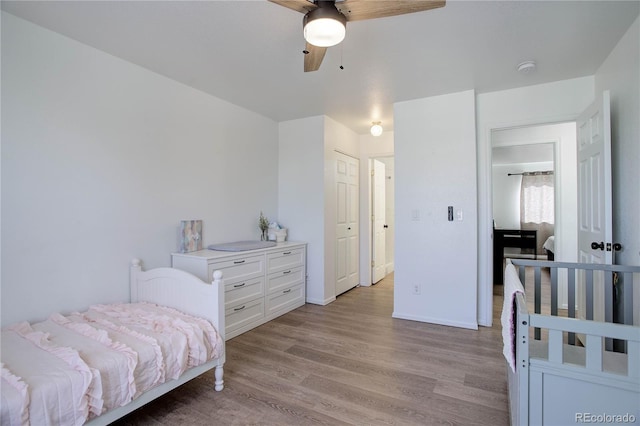 bedroom featuring ceiling fan and light wood-type flooring