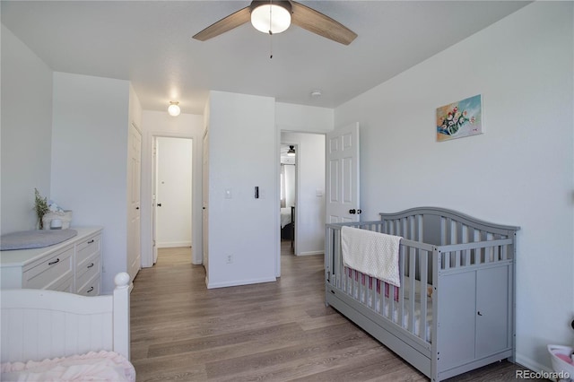 bedroom featuring light hardwood / wood-style flooring and ceiling fan