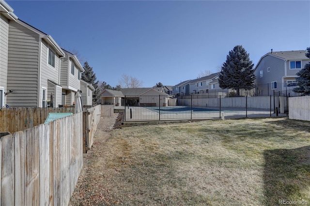 view of yard featuring a fenced in pool