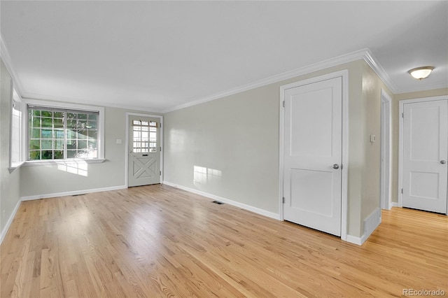 interior space featuring light hardwood / wood-style flooring and crown molding