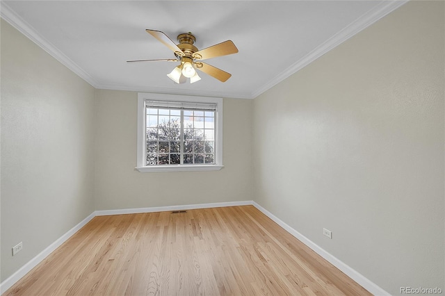 empty room featuring light hardwood / wood-style floors, ceiling fan, and crown molding