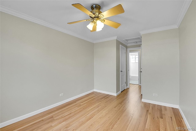 empty room with ceiling fan, ornamental molding, and light hardwood / wood-style flooring