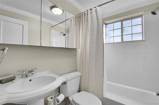 full bathroom with shower / bath combination with curtain, toilet, crown molding, and sink