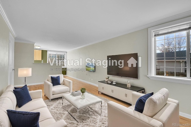 living room featuring crown molding, wood finished floors, and baseboards