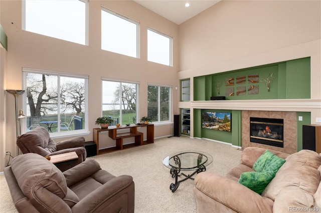 4814 S Upham Ct, Littleton, CO 80123 - carpeted living room with a towering ceiling, a fireplace, and recessed lighting