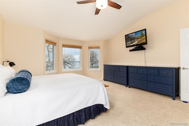 4814 S Upham Ct, Littleton, CO 80123 - bedroom featuring multiple windows, light carpet, a ceiling fan, and vaulted ceiling
