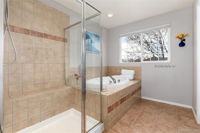 4814 S Upham Ct, Littleton, CO 80123 - bathroom featuring a stall shower, a garden tub, and tile patterned floors