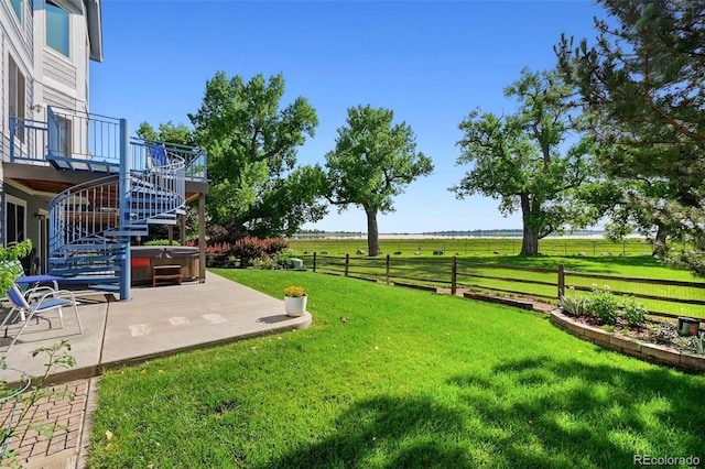 4814 S Upham Ct, Littleton, CO 80123 - view of yard with a hot tub, a patio, stairs, a view of rural / pastoral area, and a wooden deck