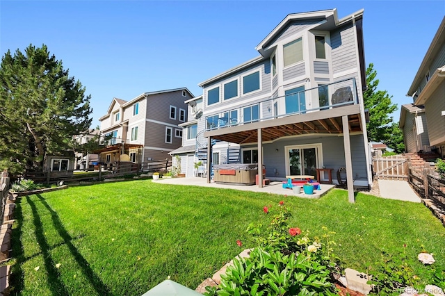 4814 S Upham Ct, Littleton, CO 80123 - rear view of house featuring a hot tub, a patio, and a fenced backyard