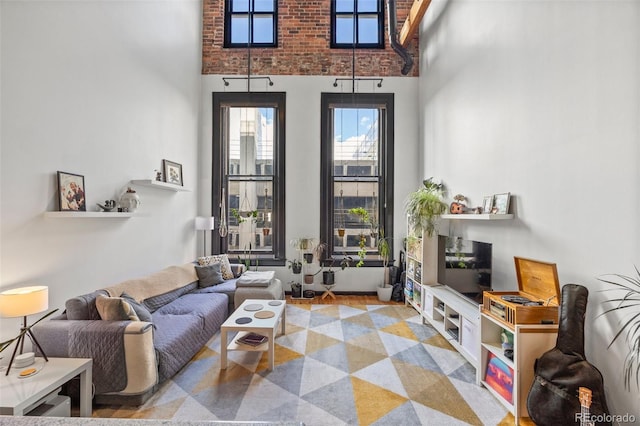 living area featuring a towering ceiling
