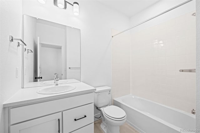 full bathroom featuring vanity, toilet, and tiled shower / bath combo