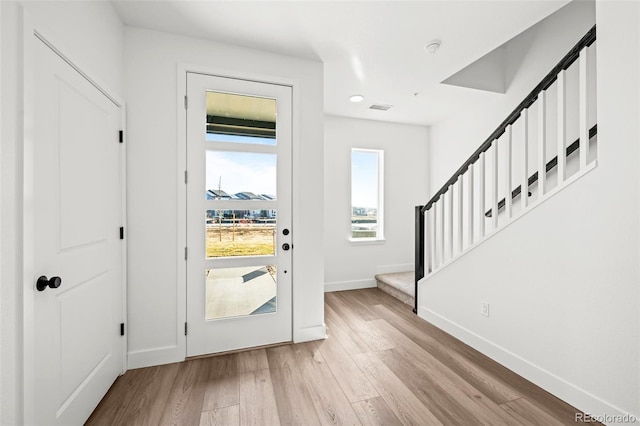 entryway with light hardwood / wood-style flooring