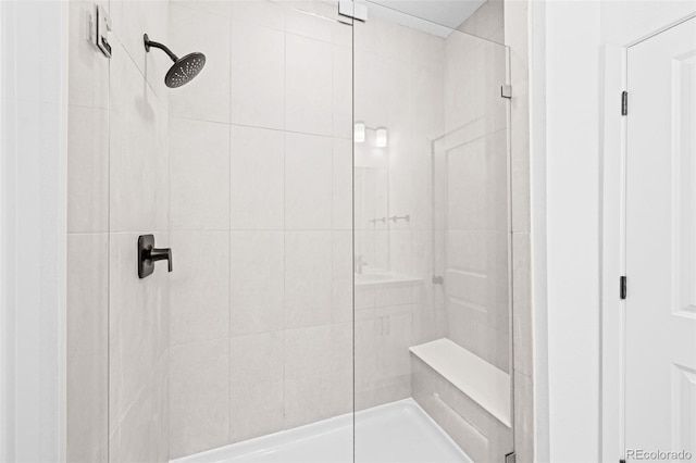 bathroom with a tile shower