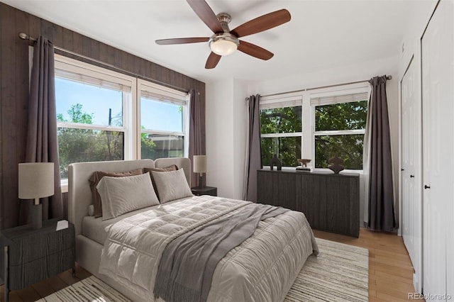11 W Ellsworth Ave Unit 22, Denver, CO 80223 - bedroom with light wood-style flooring and a ceiling fan